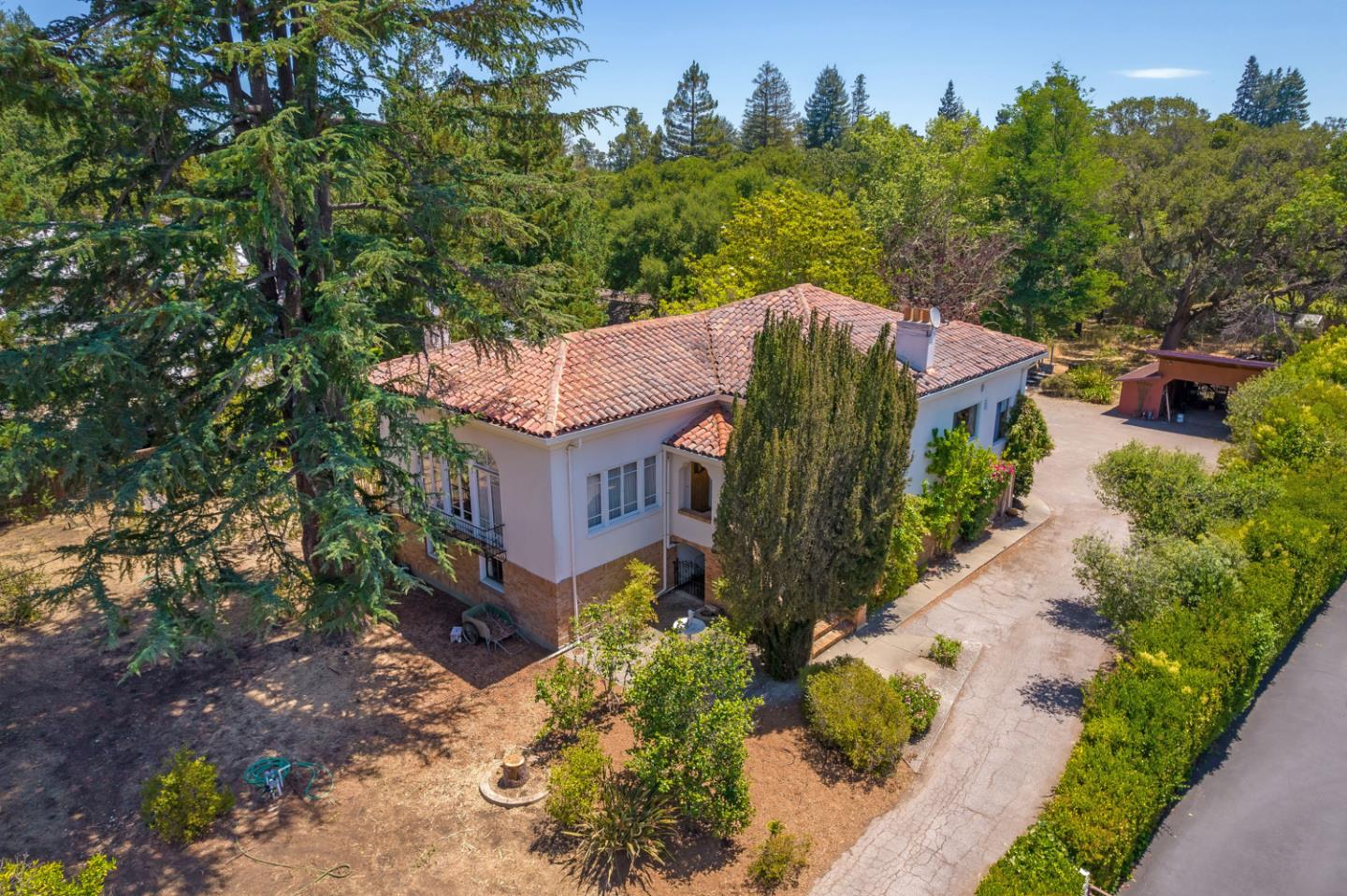 Located on one of West Atherton's most quiet and prestigious streets, this one-of-a-kind fine two-story Spanish inspired estate is situated on a large level lot with an established fruit orchard.    The main residence features 5 spacious bedrooms and 2.5 bathrooms with intricate details throughout. Beyond the main home lies a separate 1 bed/1 bath cottage with a kitchen, perfect for extended family, guests or additional office space.  167 Almendral Avenue is secluded yet conveniently located just minutes away from The Circus Club, Stanford University, renowned private schools, Sand Hill Road, and some of the most successful high-tech companies (Facebook, Google, and Apple). Atherton's mid-peninsula location is also centrally located between San Francisco and San Jose International Airports.  Because of its privacy, beauty, and location, this represents a rare opportunity to own one of the finest properties in Atherton.