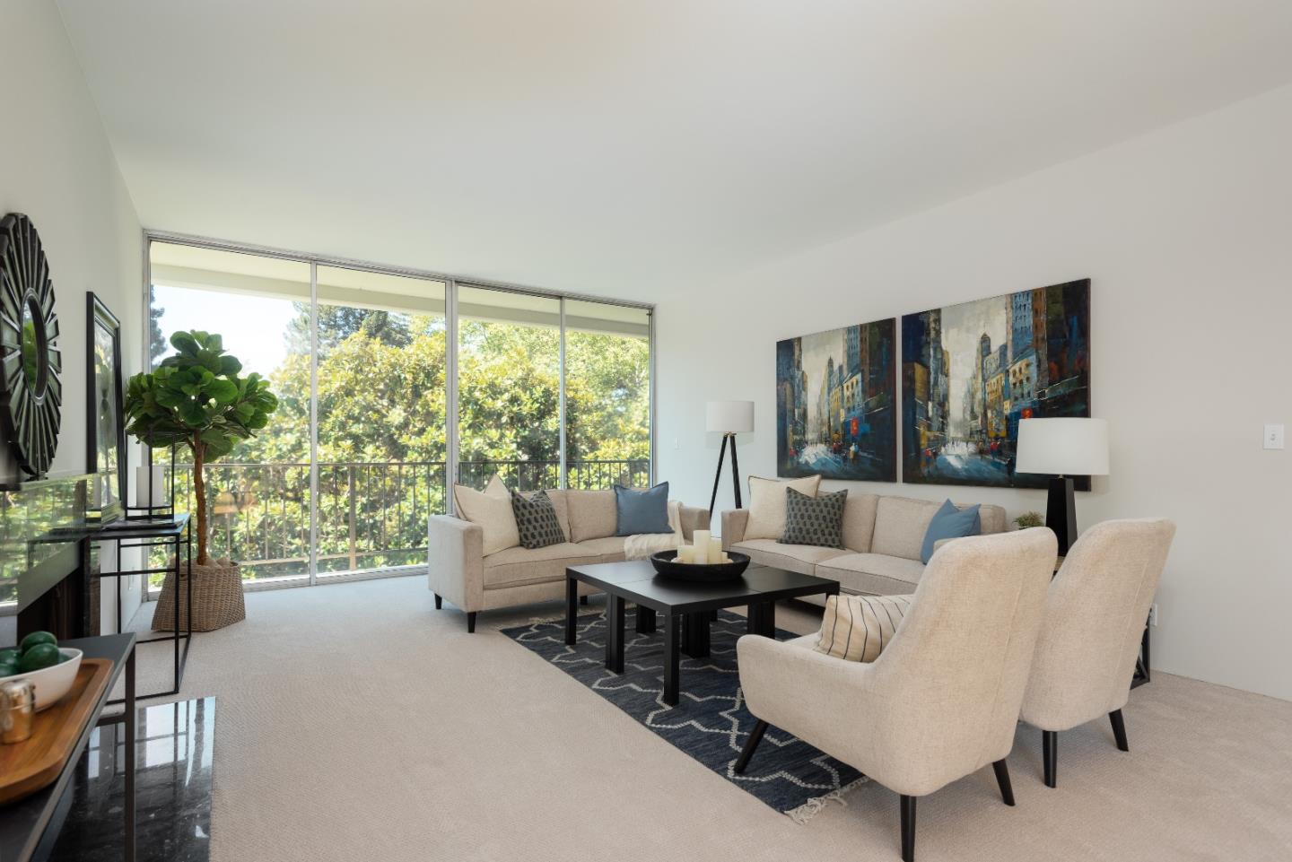 Plush turn-key gem!  Showered in natural light, this luxurious 1935+/- sf 2 bd/2 ba condo with extra den/office space exudes peaceful tranquility among tree-top views.  Freshly painted interiors and new carpeting/vinyl highlight the high ceilings, tall glass doors and windows bringing the outside in, with a large, private balcony offering alfresco seating.  Spa-like primary en suite boasts two separate sink areas, private dressing spaces, three large closets with built-in storage, and large shower/commode room.  Ample storage throughout, plus in-unit separate laundry room.  Secure building with lobby concierge, deeded one car underground parking and storage, community pool, BBQ area, gym, and social gathering space completes the deluxe ambiance.   Sought-after location:  a few blocks to downtown Menlo Park shops, restaurants, and train station; near Palo Alto and Stanford; plus easy access to outstanding schools and transportation routes.  A must see!