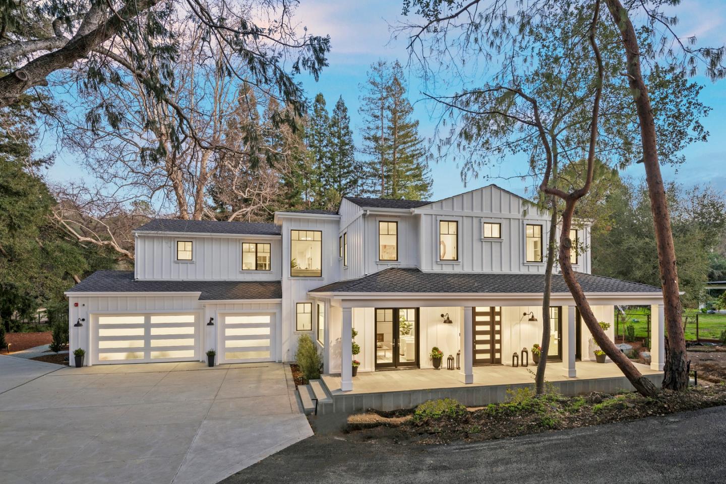 Fabulous New Construction in Saratoga Schools. Napa style Farmhouse with a contemporary flair. Builder Steve Scates has produced another high quality, beautifully designed home w/ exceptional finishes. Set upon a tranquil and picturesque environment that is sunny and bright accented by a stunning Redwood Grove. This 5 bedroom, 5 bath, 4,560 sf +/- masterpiece boast formal dining and living rooms, spacious butlers pantry, fabulous great room kitchen with high ceilings and a downstairs bedroom suite. The upstairs primary suite and 3 additional bedrooms are all en-suite. Outdoor living w/ spacious Connecticut Blue Stone patio with garden and play areas. 3 car garage. Features incl: Home automation (audio-visual-security and system management), Cleaf cabinetry, NeoLith counters, Blue glass enclosures, Emtek hardware, Fry Reglet trim profile throughout, Viking Pro 7 Series appliances, Hansgrohe, Brizo, Toto, Kohler and Graff plumbing fixtures and more!
