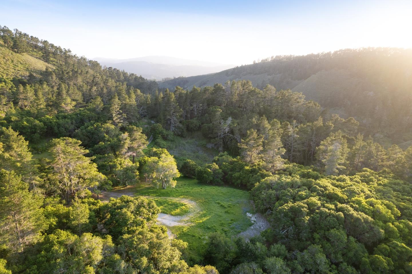 This exceptionally private 13.16-acre homesite located in the coveted Teháma community envisioned by Clint Eastwood is coming to market for the first time and features an expansive 1.04-acre building envelope immersed in natural light and surrounded by an otherworldly forest. Cloistered on its own cul-de-sac, The Sanctuary impresses with an entrance through a wooded landscape reminiscent of entering a National Park. While mostly level, the building envelope also slopes up the hillside, affording discretion for crafting an architecturally distinctive home that incorporates the natural elevation into its design. Be among the few to reside in an exclusive locale marked by a thoughtful vision of sustainability. Owners enjoy Teháma social membership (subject to dues, fees & rules/regulations), including dining, fitness center, tennis and swimming pools. Located in the highly rated Carmel School District, Teháma has secure, gated entrances and is minutes from both Carmel-by-the-Sea and Monterey.